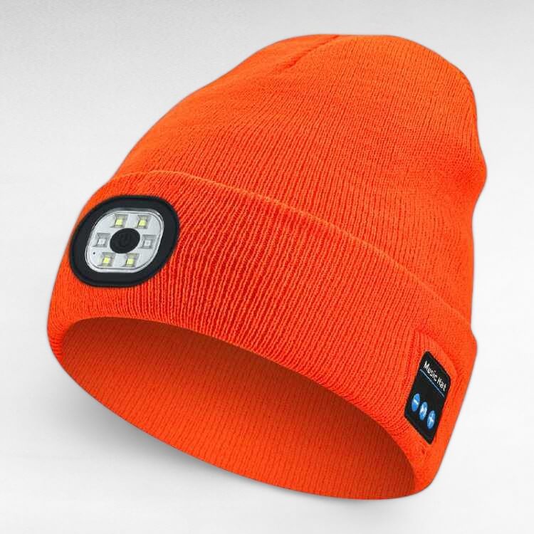Assortment of unisex LED Bluetooth beanies in various colors (black, gray, blue, red) on a display, outdoor gear.