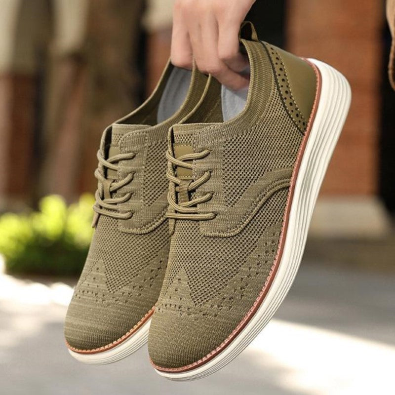 Front view of stylish grey unisex sneakers, lightweight and breathable for daily wear and streetwear.