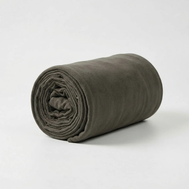 Rolled-up lightweight fleece sleeping bag. Portable adult camping gear for hiking & travel. Compact 3-season comfort solution.