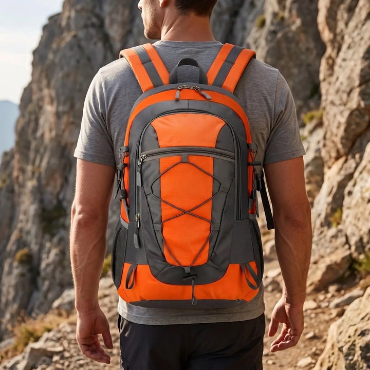 Unisex lightweight hiking daypack for outdoor trails. Breathable nylon, multi-compartment for adventure.