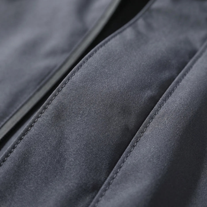 Hooded unisex lightweight rain jacket, perfect travel gear & windbreaker for outdoor adventures.