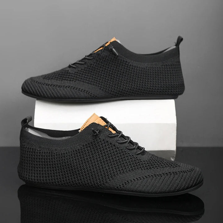 Ergonomic lightweight mesh knit slip-on sneakers, providing unisex comfort & support.