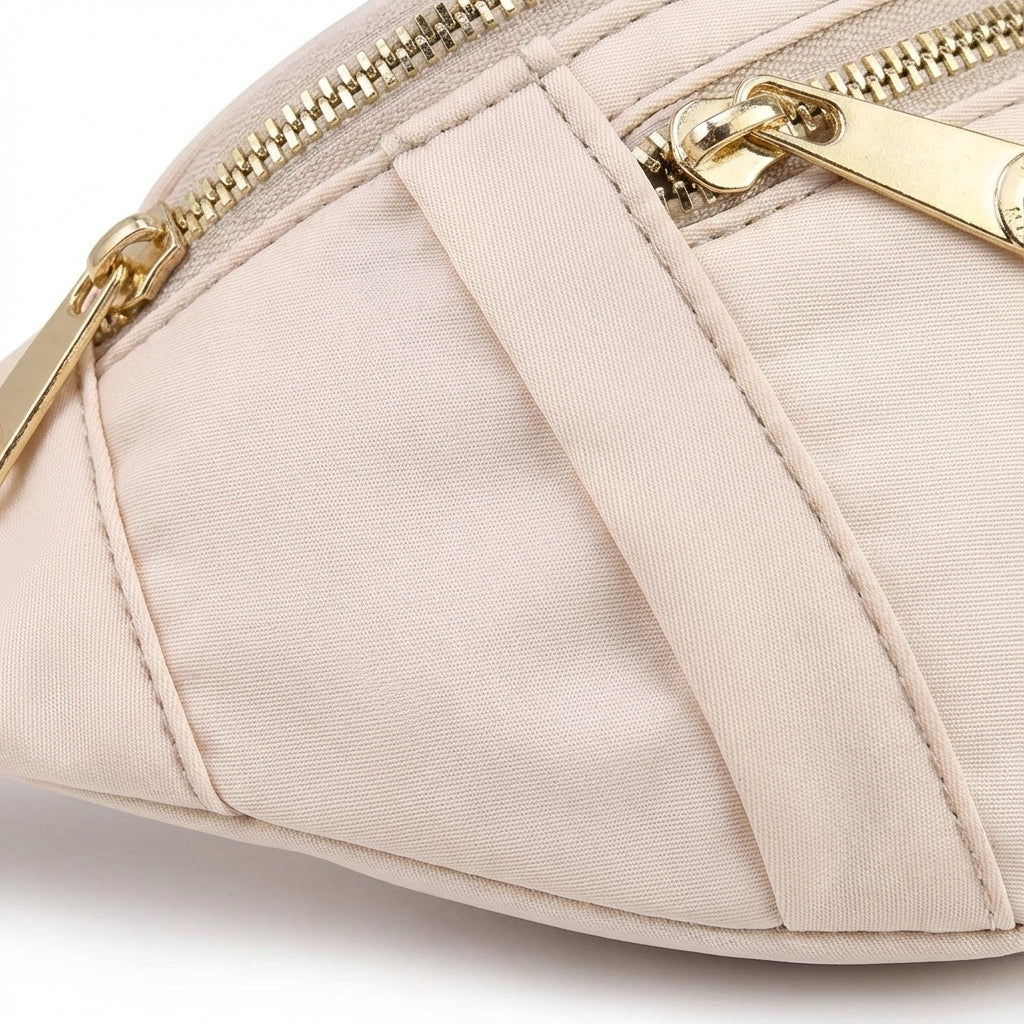 Close-up of a lightweight nylon waist bag, highlighting secure zippered pockets for essentials.