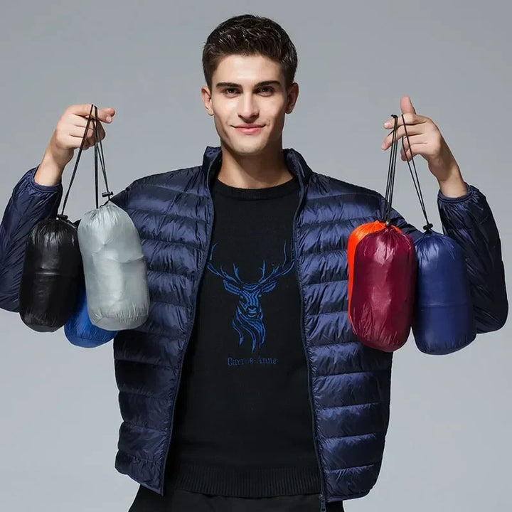 Packable unisex puffer jacket, ideal lightweight outerwear for travel, camping, and adventure. Easy to store.