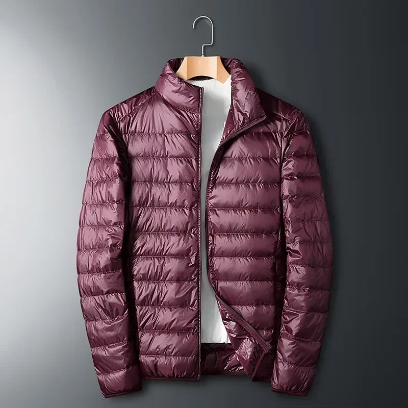 Stylish unisex puffer jacket, lightweight, packable, and versatile for everyday wear or outdoor winter adventures.