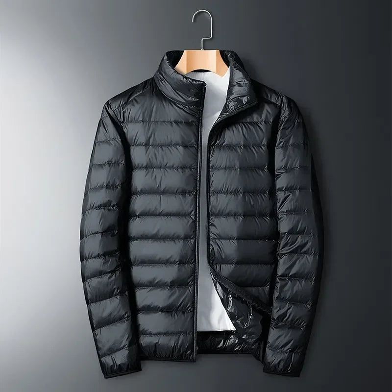 Unisex lightweight puffer jacket for winter sports, hiking, and camping. Packable design for ultimate travel convenience.
