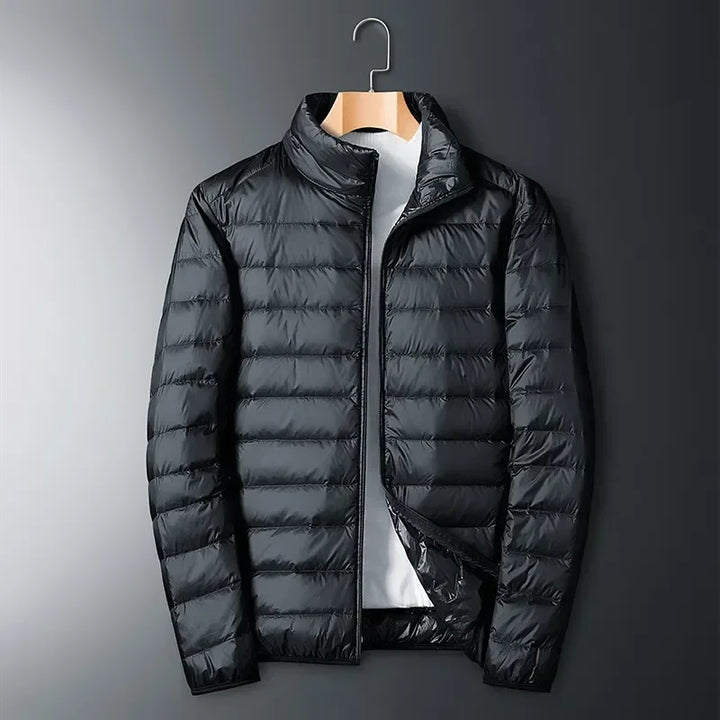 Unisex lightweight puffer jacket for winter sports, hiking, and camping. Packable design for ultimate travel convenience.