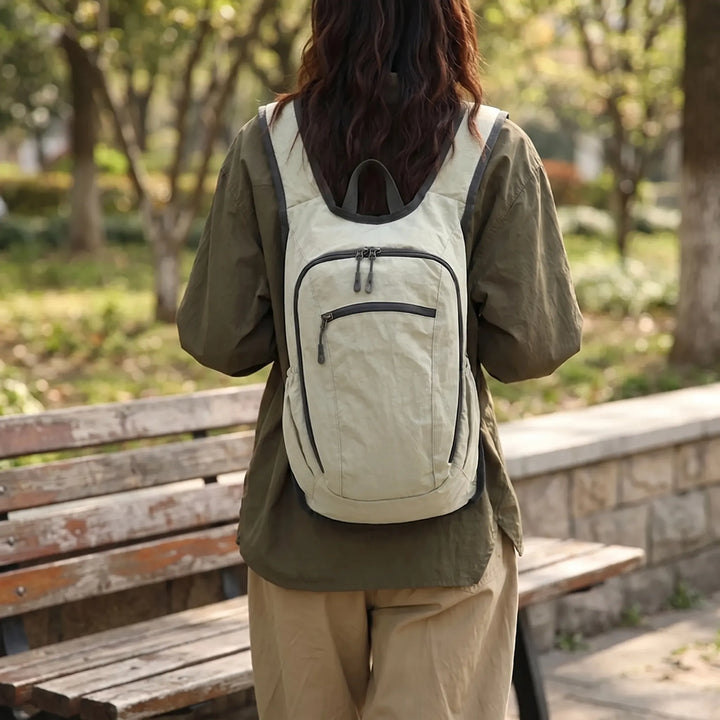 Unisex lightweight travel daypack with multiple pockets, perfect for casual trips & everyday carry.