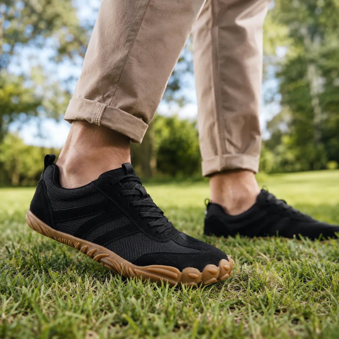 A pair of unisex wide fit barefoot hiking shoes, showcasing their lightweight construction and outdoor readiness.