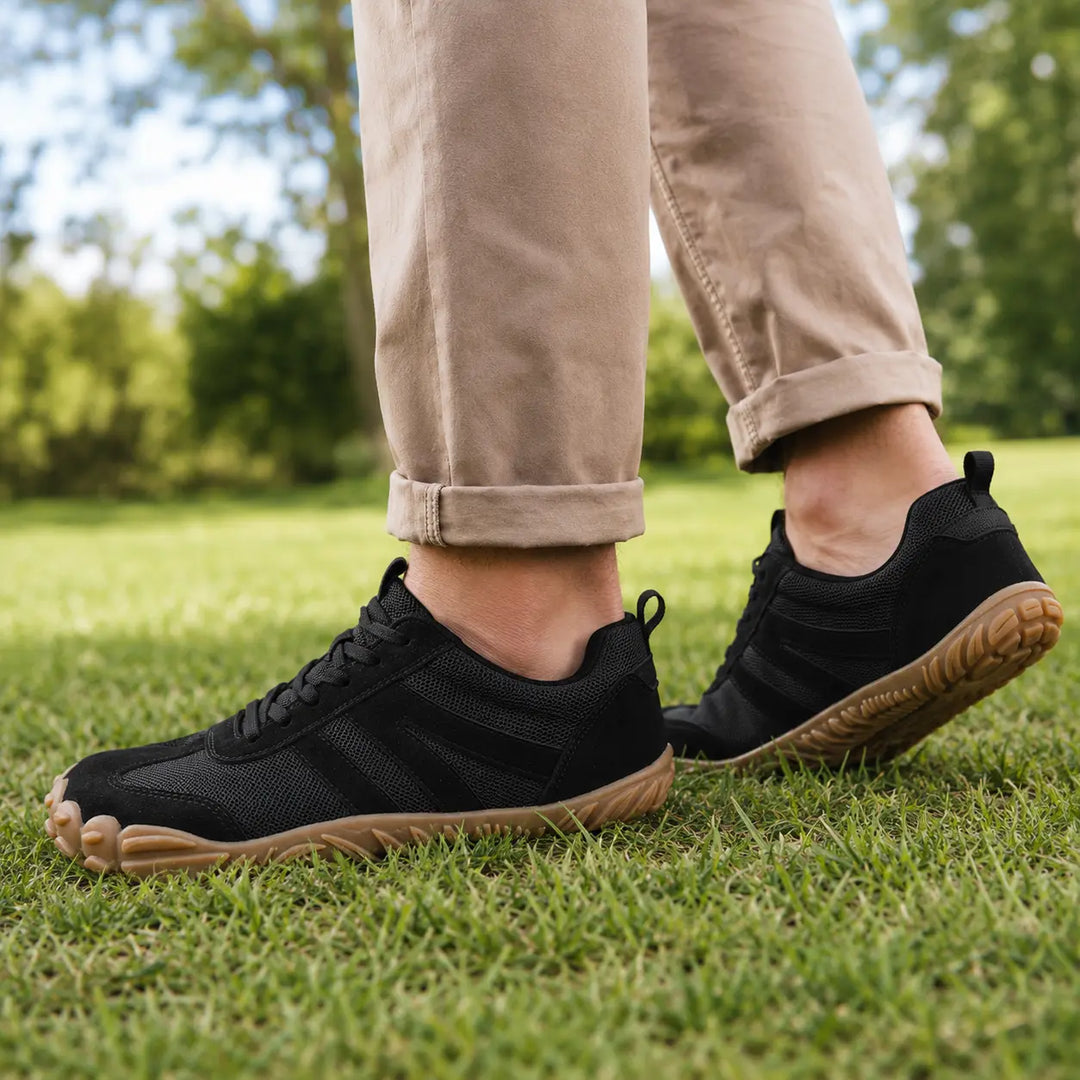 Side profile of lightweight barefoot hiking shoes, highlighting flexible design, wide fit & traction sole.