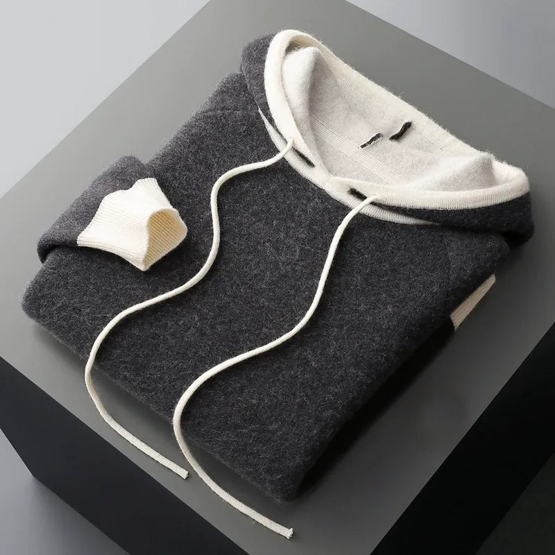 Detail of the soft hood and drawstring on a cozy unisex pullover hoodie, ideal for casual layering.