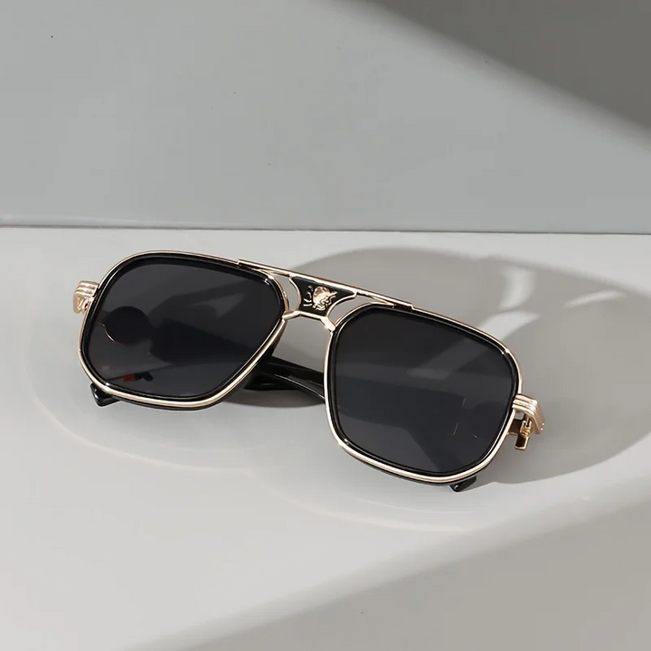Fashionable unisex luxury gradient sunglasses, offering UV protection, gold accents & a sophisticated look.