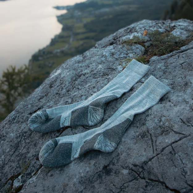 Breathable Merino wool hiking socks in a natural color, designed for outdoor enthusiasts