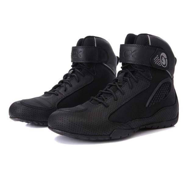 Unisex off-road adventure motorcycle boots, black with protective ankle armor and rugged sole.