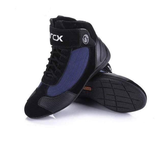 Adventure riding gear: high-cut motorcycle boots with multiple buckles for secure off-road use.