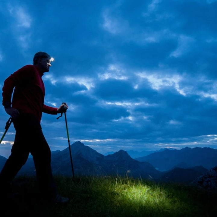 Compact LED headlamp, perfect for camping and illuminating dark trails during night running.