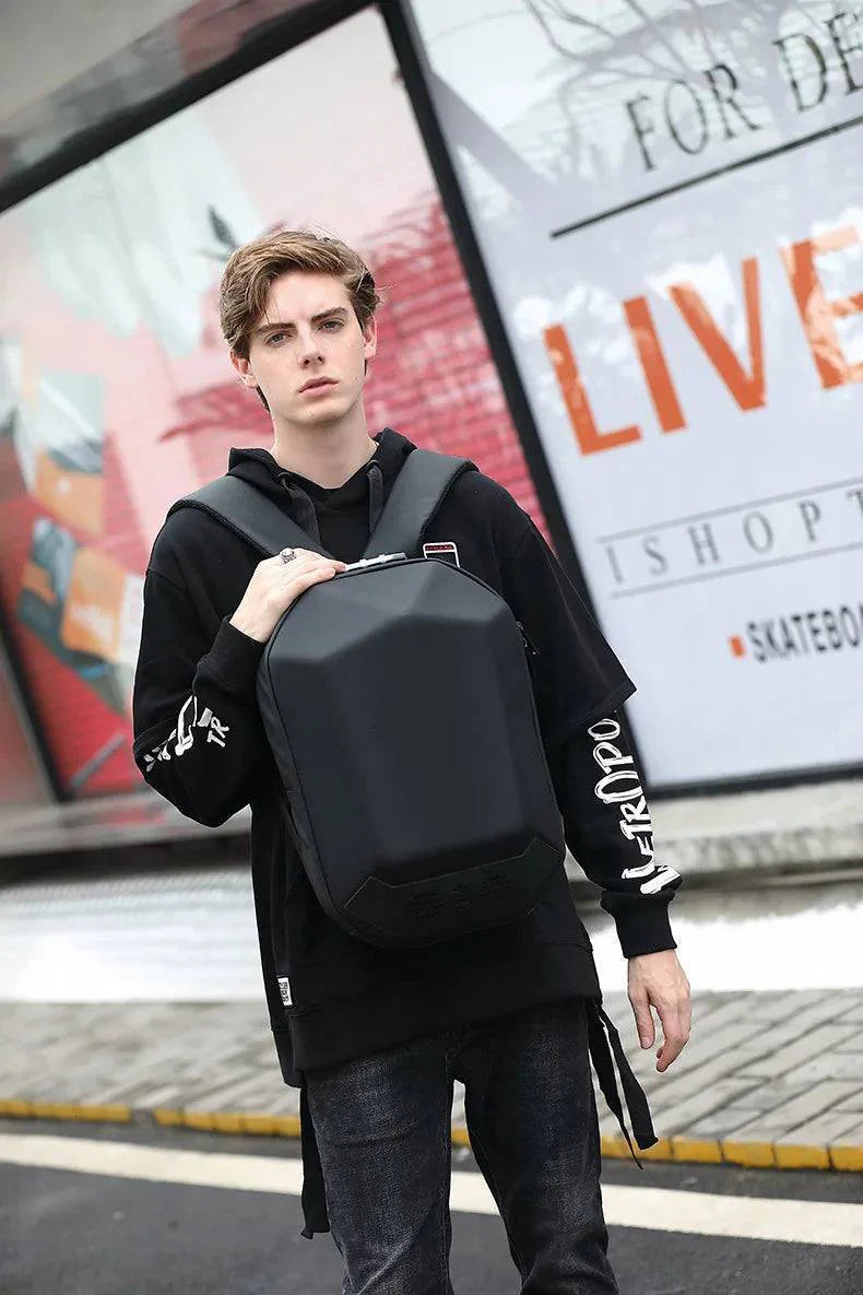 Person wearing a black outdoor music box backpack, demonstrating its comfortable fit and design.