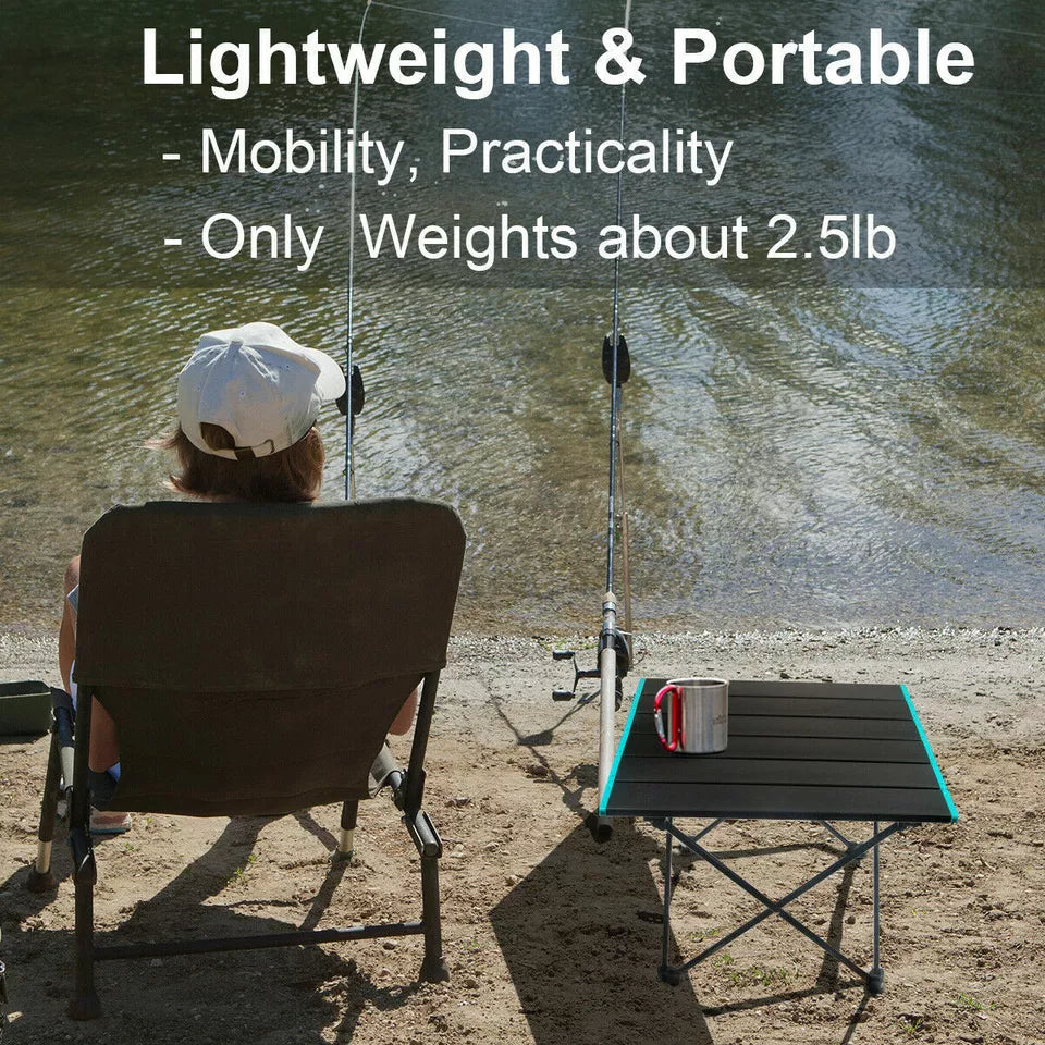Portable folding camping table, lightweight and compact, perfect for outdoor enthusiasts and travel.