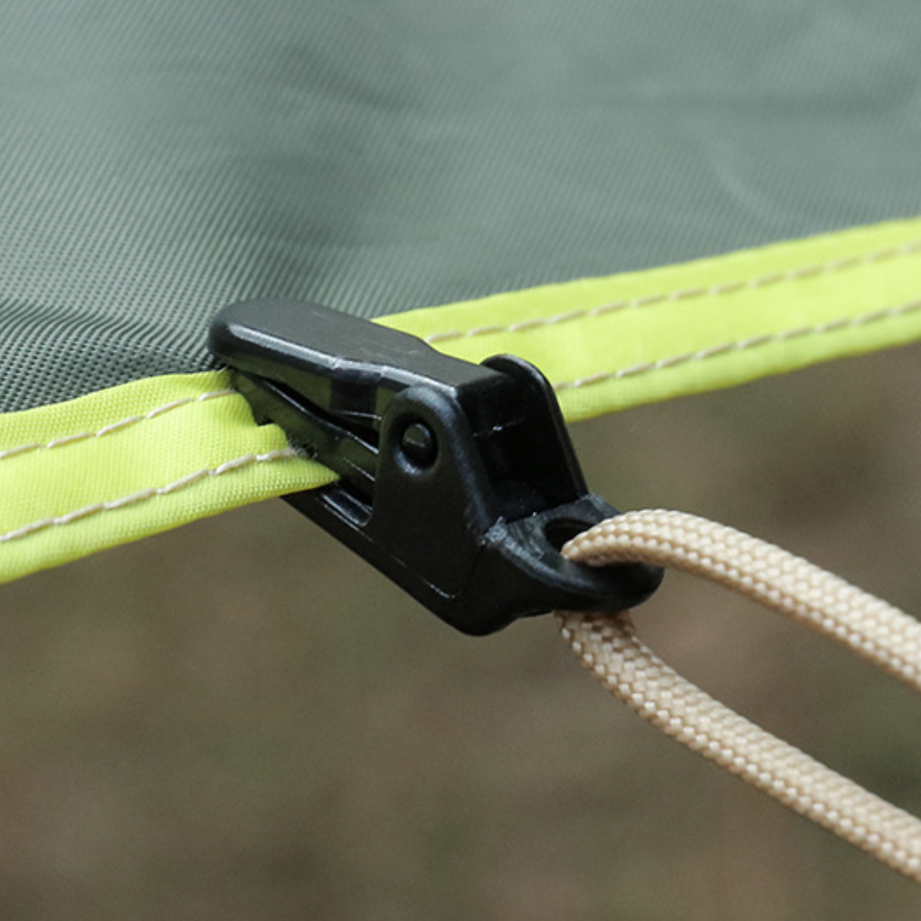 Camping gear essentials: WindGrip Tent Clips holding a tarp firmly, showcasing their grip