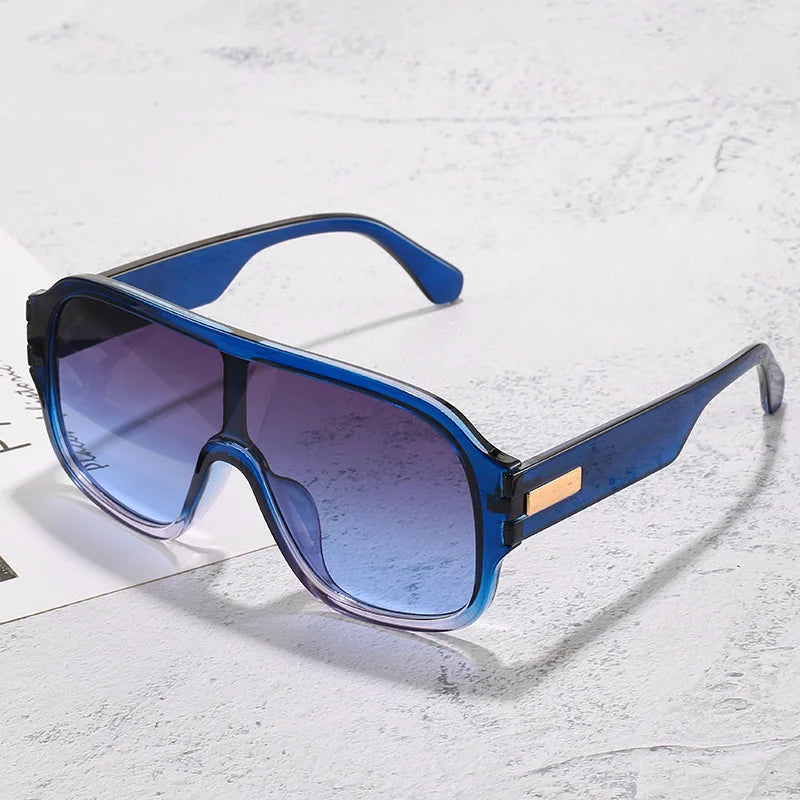 Unisex oversized gradient lens sunglasses, a stylish and modern eyewear accessory.
