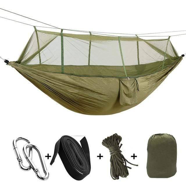 Empty portable camping hammock with mosquito net, inviting for a relaxing outdoor experience.