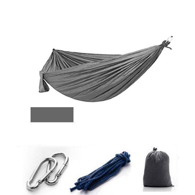 Camping hammock with mosquito net from an aerial view, demonstrating its spacious and secure design.