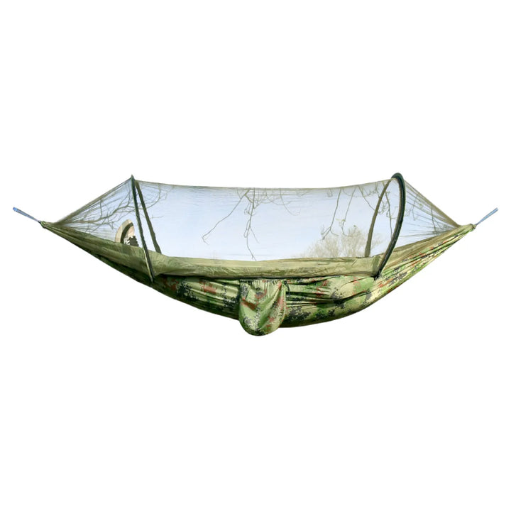 Green unisex camping hammock with built-in mosquito net, shown in a forest.