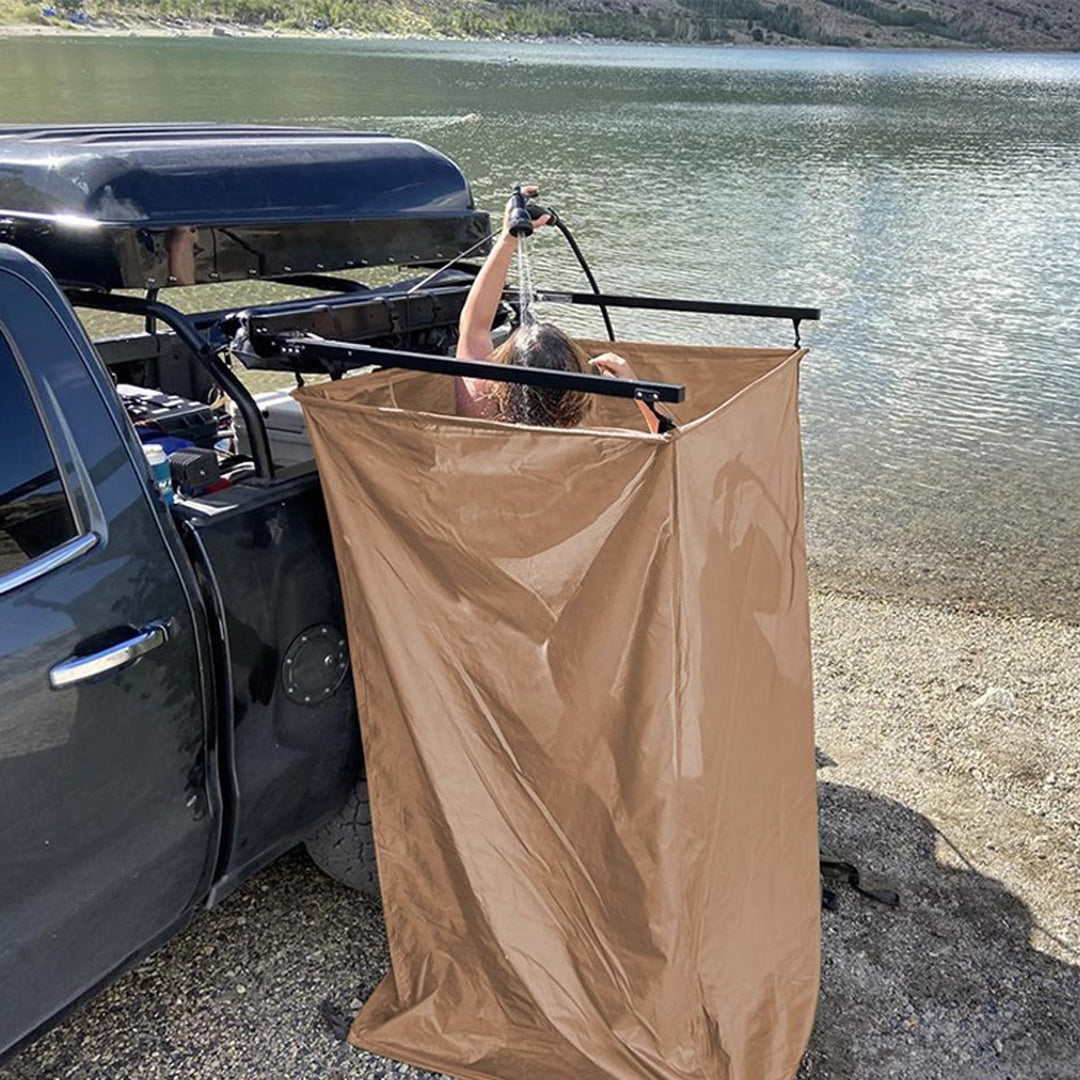 Car-mounted privacy tent with zipper door, ensuring full enclosure for outdoor changing and showering.