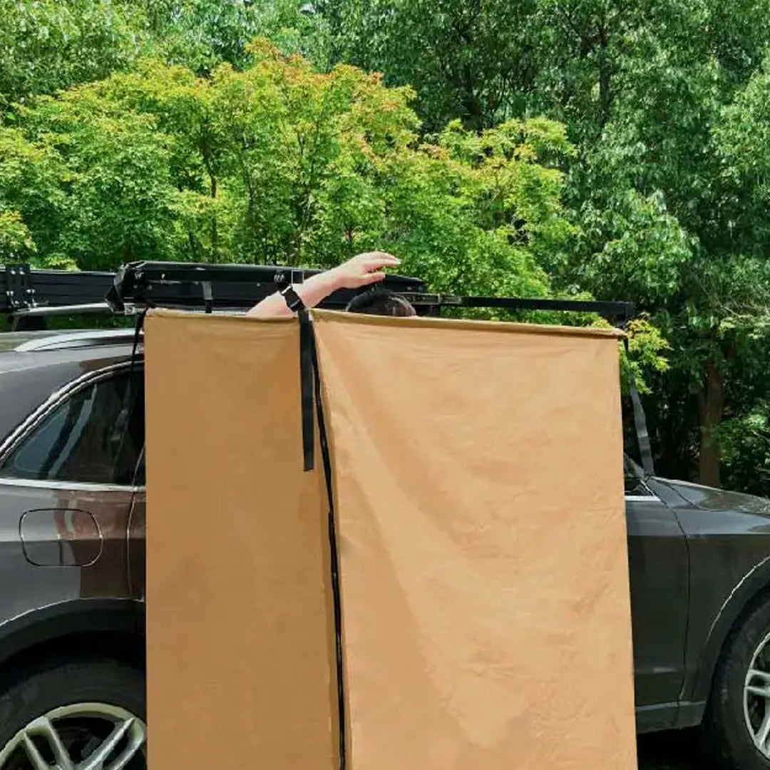 Portable shower tent for vehicles, offering a private space for hygiene during travel and camping.