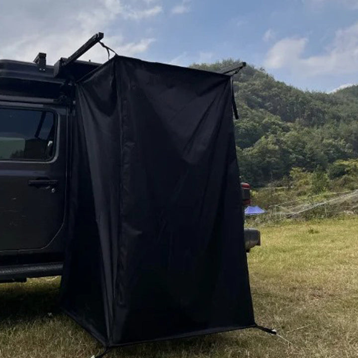 Folded portable car-mounted privacy tent, showing its compact storage and travel-readiness.