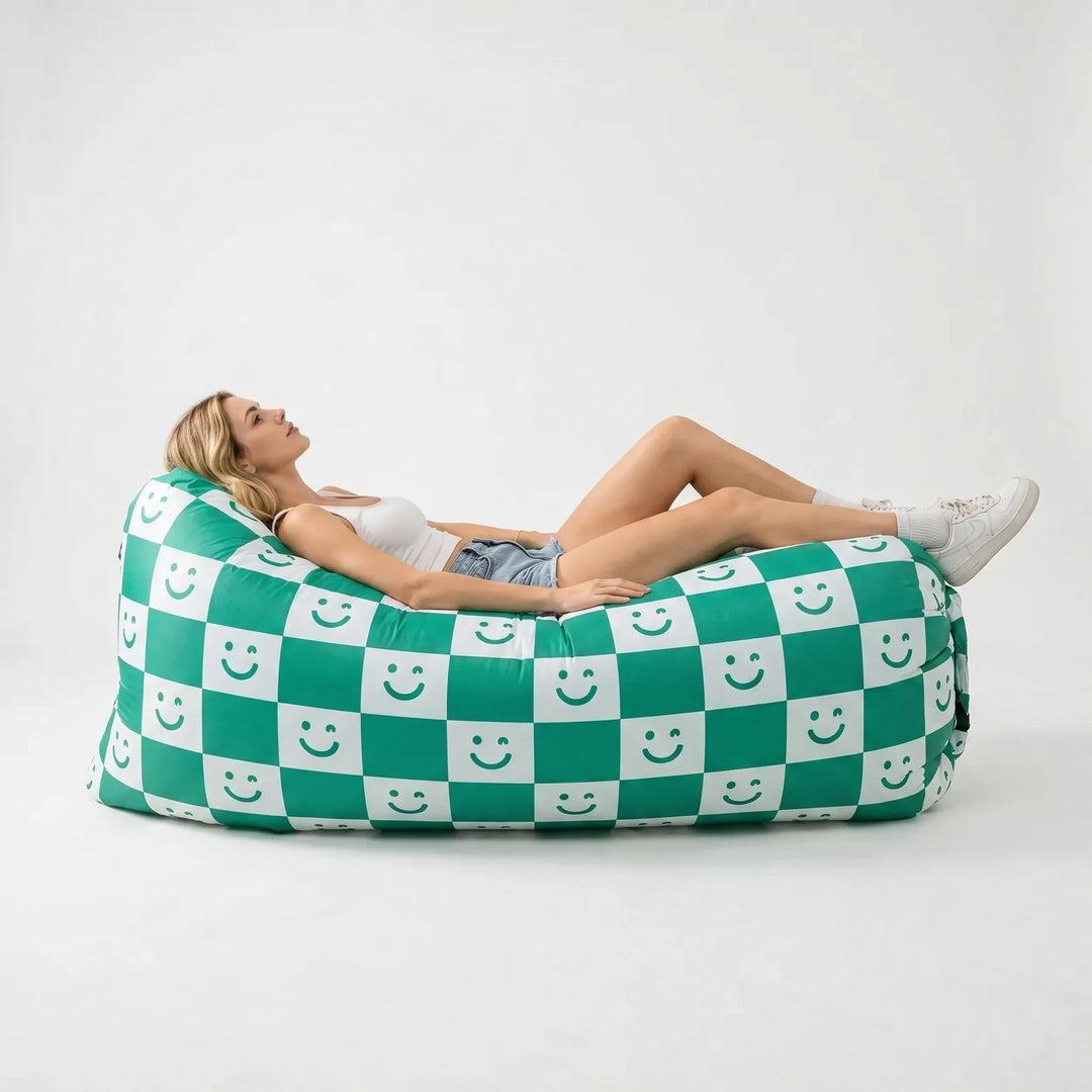 Pump-free inflatable air lounger for quick setup outdoor seating. Comfortable, portable sofa for all your adventures.