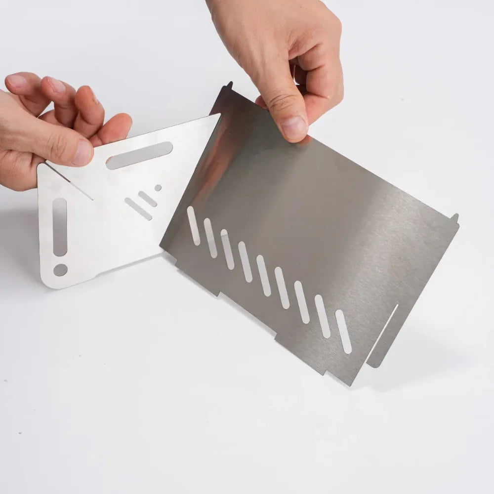 Close-up of the grill grate on a portable stainless steel camping grill for camp stove cooking.