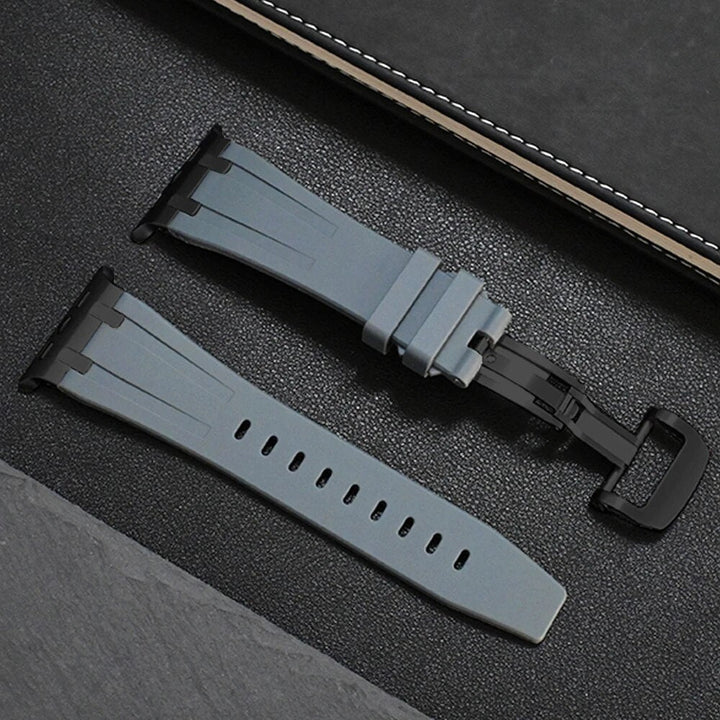 Black silicone watch accessory, a durable smartwatch strap with onyx buckle.