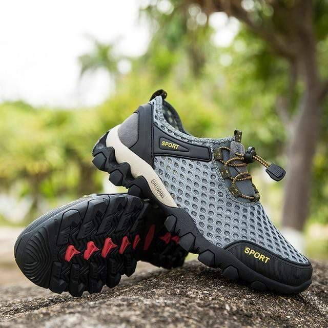 Close-up of quick-dry aqua trekking shoes showing breathable mesh and durable sole