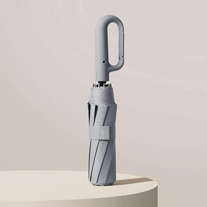 Portable & durable travel umbrella. Lightweight, windproof, UV protected, and automatic for easy carrying.