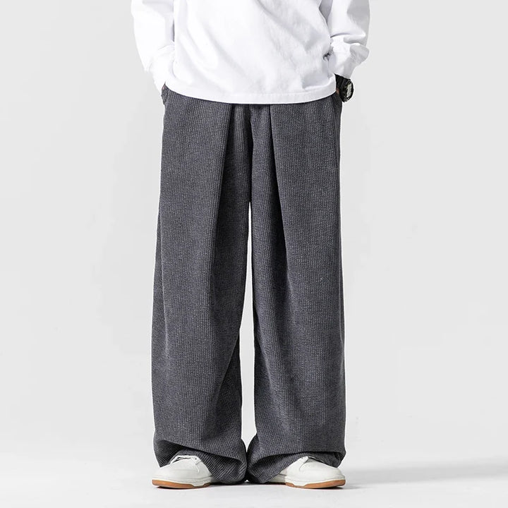 Unisex wide-leg pants with drawstring, a relaxed fit essential for comfortable, everyday casual fashion.