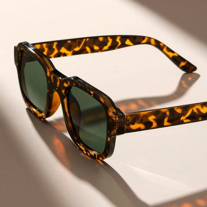 Chic leopard print retro bold frame sunglasses, unisex fashion accessory for summer and UV protection.
