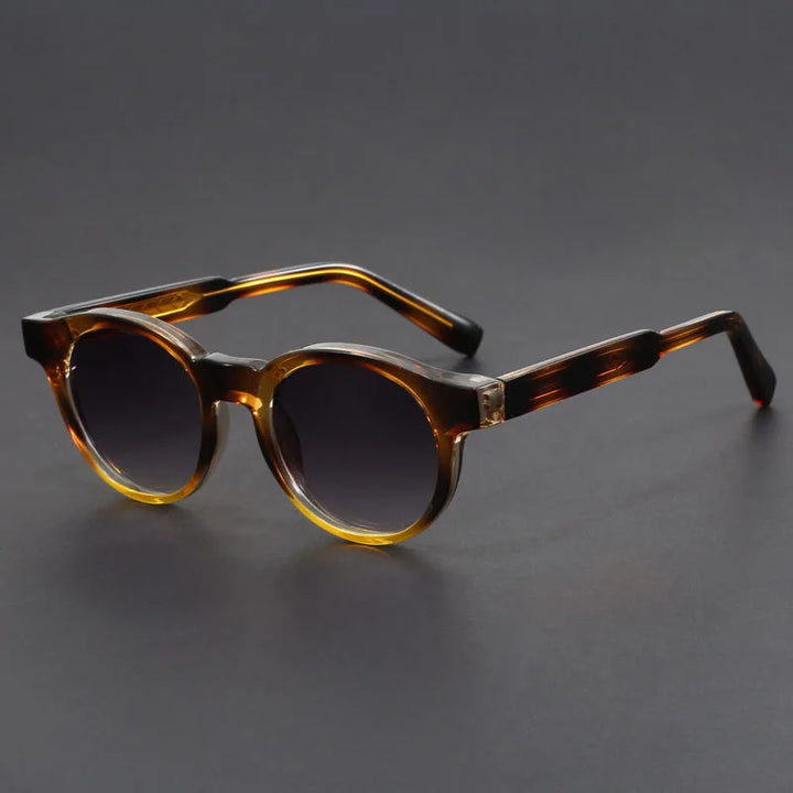 Classic round sunglasses offering UV protection. Retro unisex eyewear for sunny days.