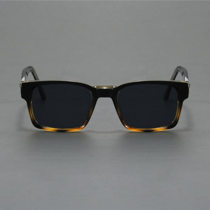 Fashionable unisex retro squared-frame sunglasses with superior UV protection.