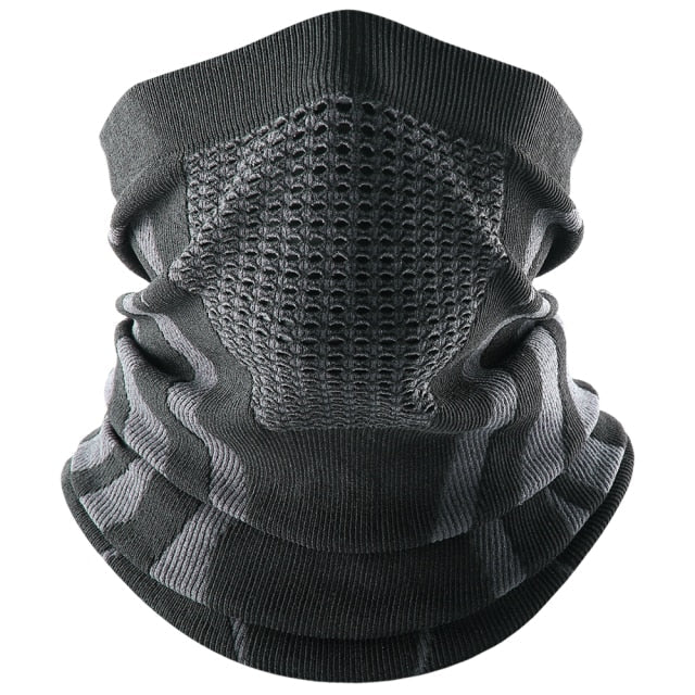 Unisex reversible neck gaiter in black, worn as a warm neck warmer for winter outdoor activities