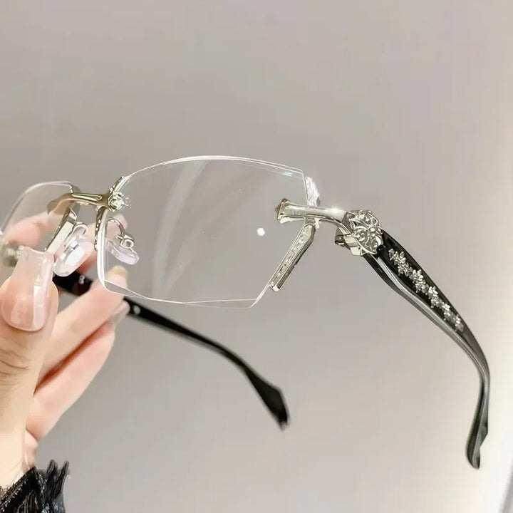 Unisex rimless optical glasses. Lightweight silver metal frame with crystal clear lenses for an elegant, sophisticated look.