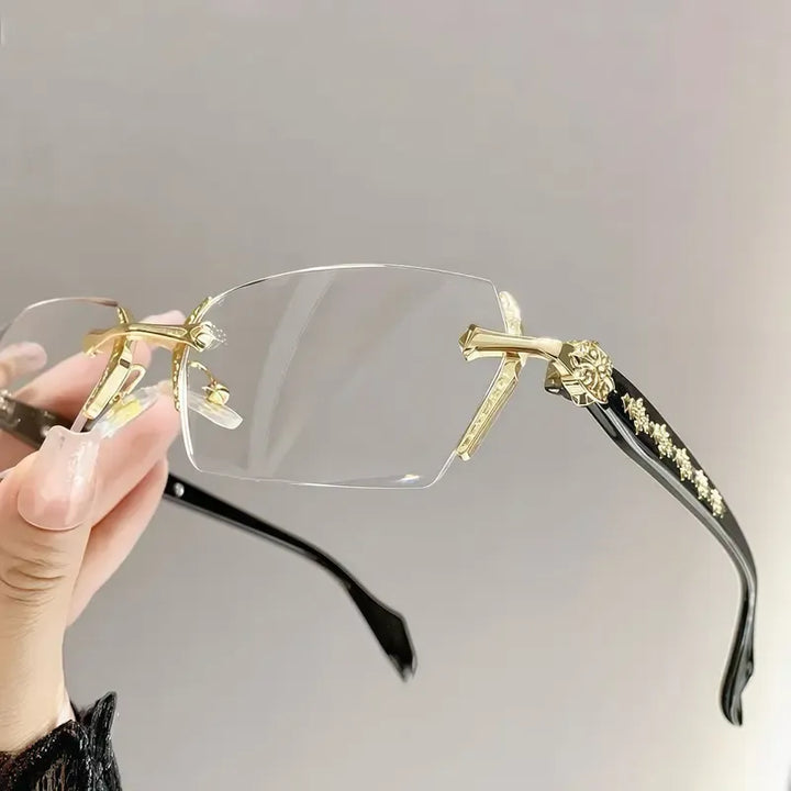 Modern unisex rimless glasses. Elegant, minimalist design with a silver metal frame, offering a lightweight & clear optical view.