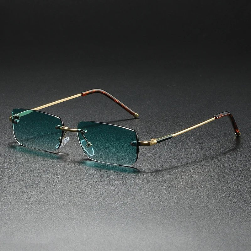 Unisex rimless rectangular gold sunglasses with gradient tinted lenses. Fashionable & UV protective eyewear.