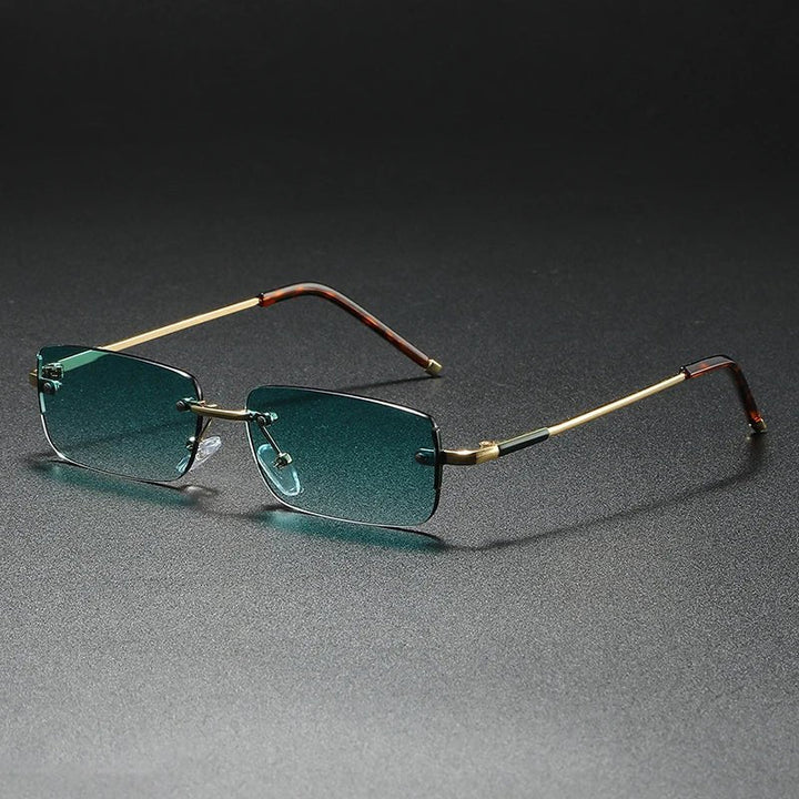 Unisex rimless rectangular gold sunglasses with gradient tinted lenses. Fashionable & UV protective eyewear.