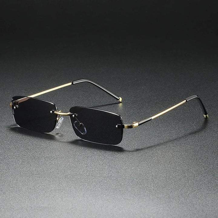 Designer rimless rectangular sunglasses with gradient lenses. Gold accents, UV protection & elegant tinted eyewear.
