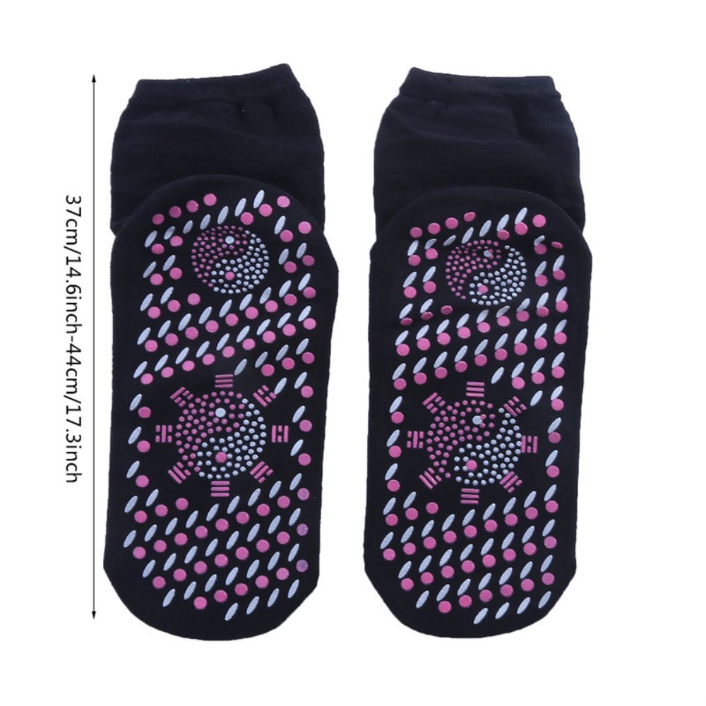 Warm unisex self-heating socks provide cozy thermal comfort. Essential foot warmers for cold weather and winter sports.