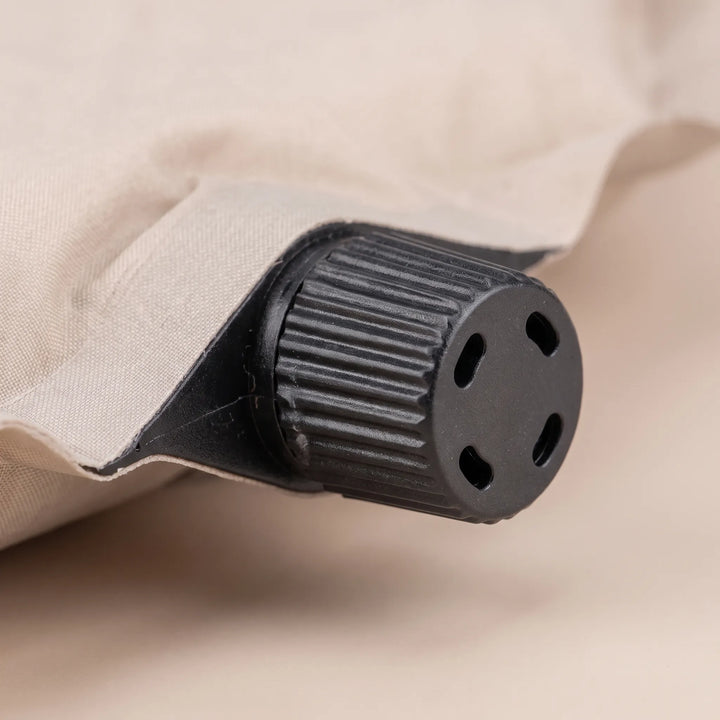 Comfortable self-inflating foam sleeping pad with durable material, ideal for camping, hiking, and travel.