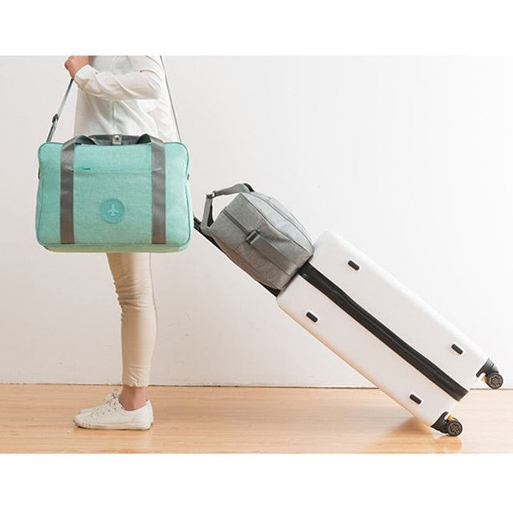 Smart unisex carry-on suitcase with efficient internal organization for travel accessories & overhead storage.