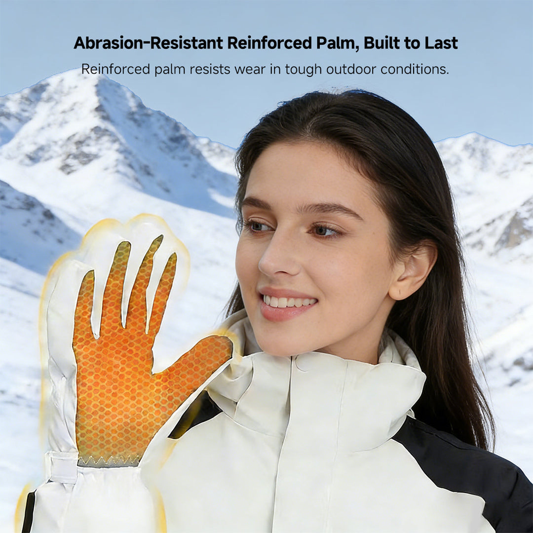 User wearing black heated skiing gloves, demonstrating touchscreen compatibility on a smartphone.