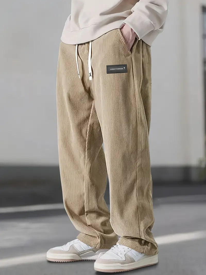 Unisex soft corduroy wide leg pants with adjustable drawstring, perfect for comfort & style.
